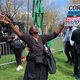 Dorothy Raines, of Newark, reacting to stage music as she waits for U.S. Senator and presidential candidate Cory Booker to take the stage for his hometown presidential campaign celebration on April 13, 2019.